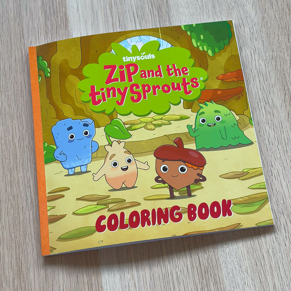 Coloring book titled 'Zip and the Tiny Sprouts' lying on a wooden table